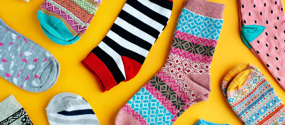 Multi-colored-socks-on-a-yellow-background