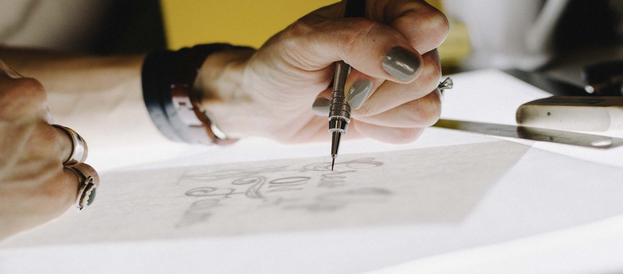 woman drawing logos